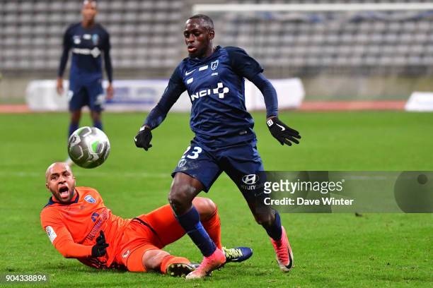 Souleymane Karamoko of Paris FC and Thomas Gamiette of FBBP 01 during the Ligue 2 match between Paris FC and Bourg en Bresse at Stade Charlety on...