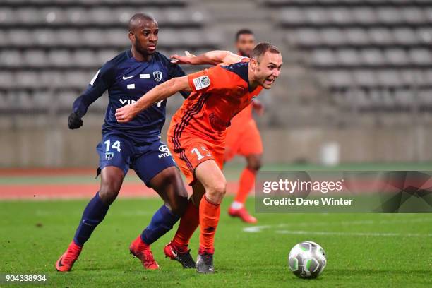 Jimmy Nirlo of FBBP 01 and Cyril Mandouki of Paris FC during the Ligue 2 match between Paris FC and Bourg en Bresse at Stade Charlety on January 12,...