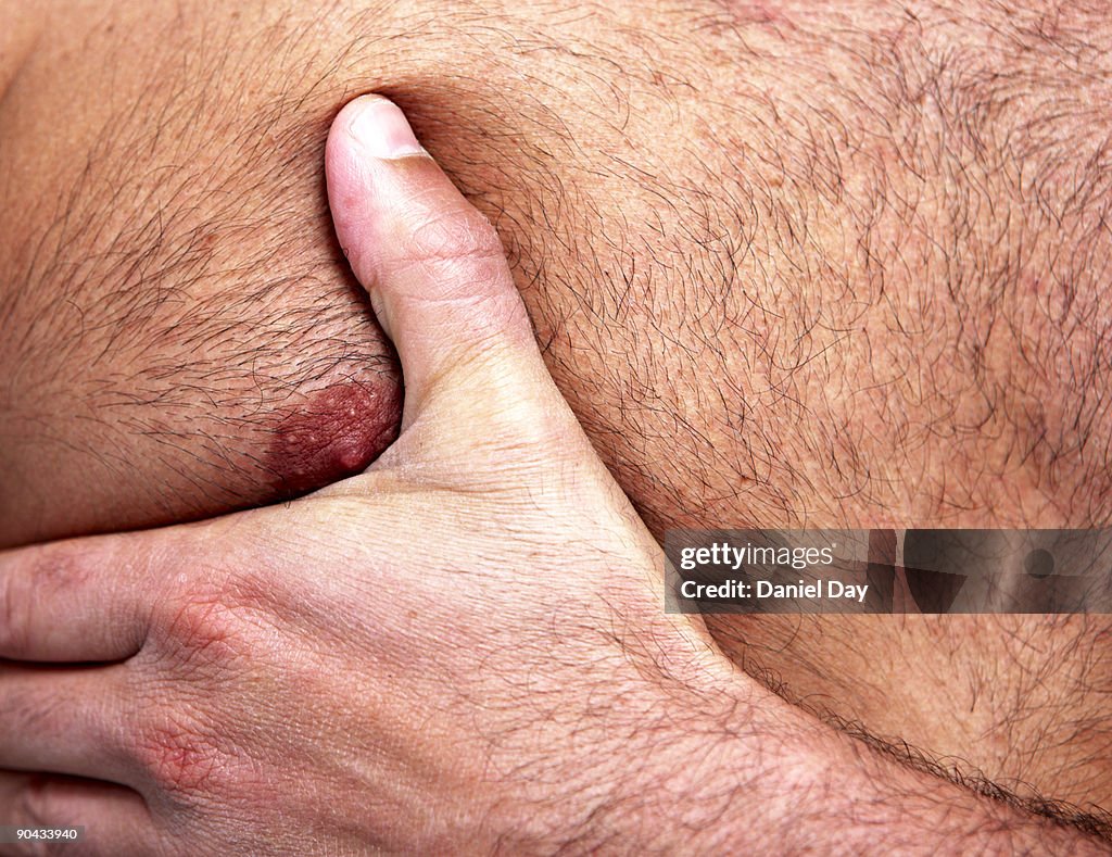 Man with hand on chest