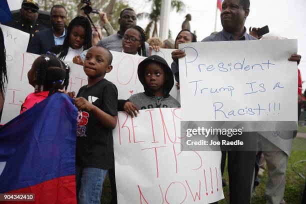 People join together to mark the 8th anniversary of the massive earthquake in Haiti and to condemn President Donald Trump's reported statement about...