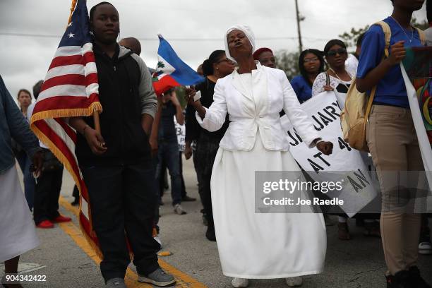 Jocelyne Pierre joins with others to mark the 8th anniversary of the massive earthquake in Haiti and to condemn President Donald Trump's reported...