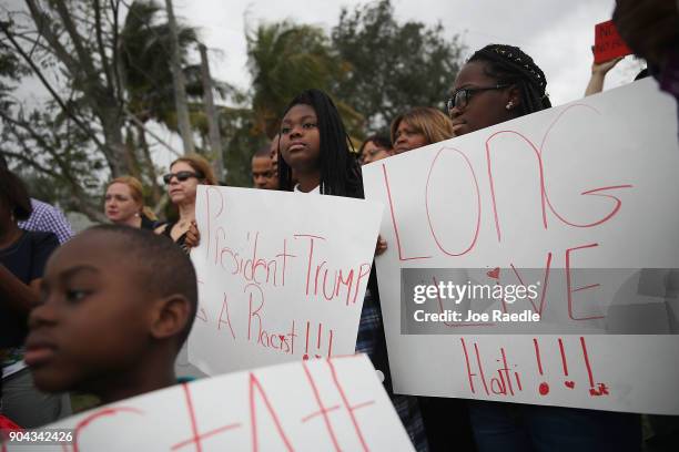 People join together to mark the 8th anniversary of the massive earthquake in Haiti and to condemn President Donald Trump's reported statement about...