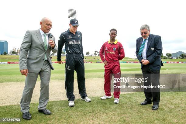 Captains Kaylum Boshier of New Zealand and Emmanuel Stewart of the West Indies take part in the coin toss while presenter Danny Morrison looks on...