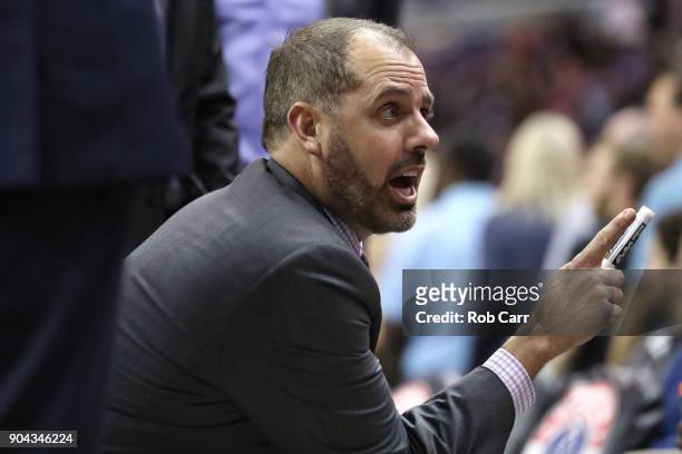 Head coach Frank Vogel of the Orlando Magic talks with his team during a timeout in the first half against the Washington Wizards at Capital One...