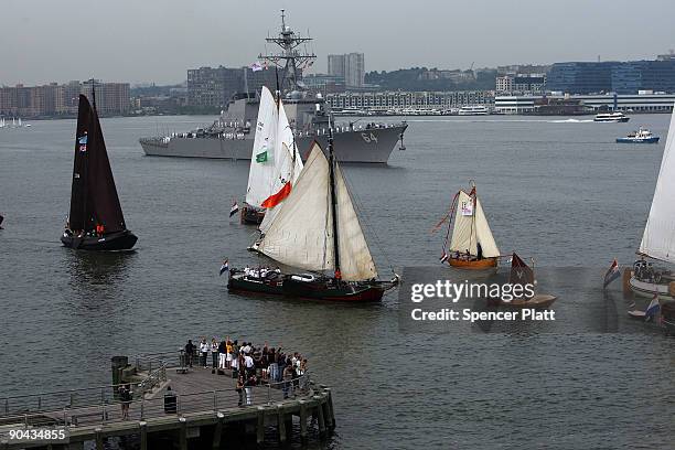 Flotilla of 11 ships comprised of Dutch Naval Frigates, NATO vessels, Dutch barges, and a replica of Henry Hudson�s "Half Moon" sail past the USS...