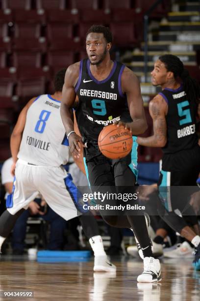 Mangok Mathiang of the Greensboro Swarm handles the ball against the Texas Legends at NBA G League Showcase Game 17 on January 12, 2018 at the...