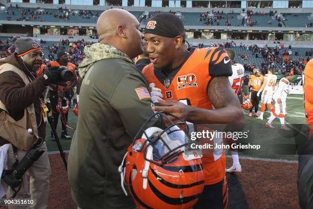 Darqueze Dennard of the Cincinnati Bengals shares a moment with Head Coach Hue Jackson of the Cleveland Browns during their game at Paul Brown...