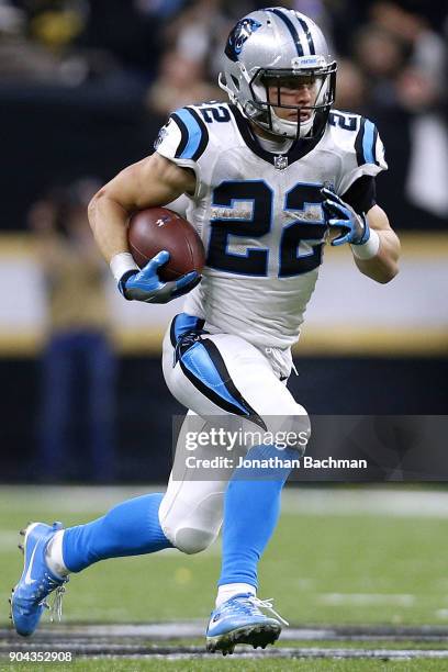 Christian McCaffrey of the Carolina Panthers runs with the ball during the NFC Wild Card playoff game against the New Orleans Saints at the...