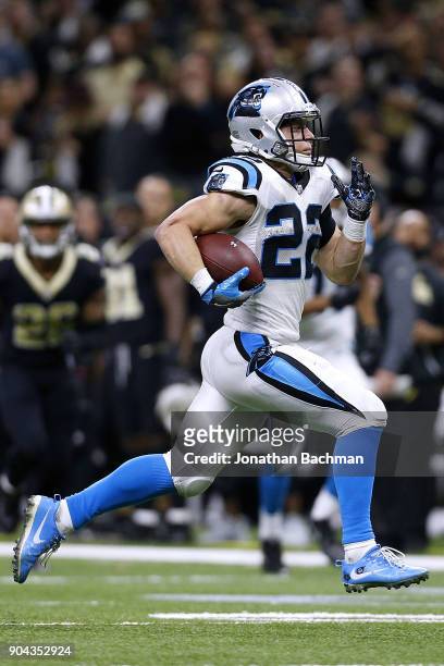 Christian McCaffrey of the Carolina Panthers runs with the ball during the NFC Wild Card playoff game against the New Orleans Saints at the...