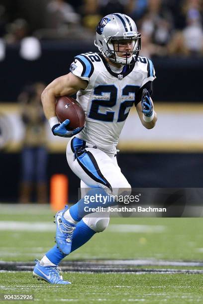 Christian McCaffrey of the Carolina Panthers runs with the ball during the NFC Wild Card playoff game against the New Orleans Saints at the...