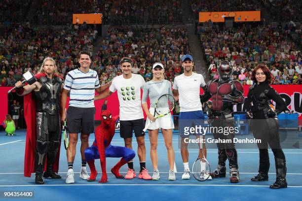 Milos Raonic of Canada, Roger Federer of Switzerland, Caroline Wozniacki of Denmark and Novak Djokovic of Serbia, pose with Marvel characters...