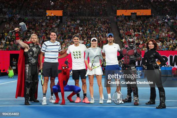 Milos Raonic of Canada, Roger Federer of Switzerland, Caroline Wozniacki of Denmark and Novak Djokovic of Serbia, pose with Marvel characters...