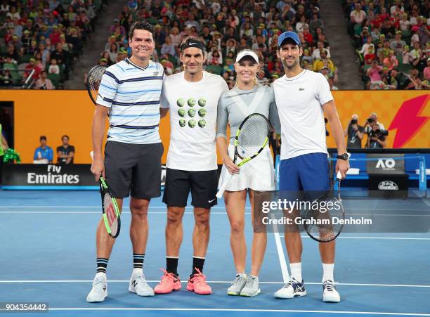 Milos Raonic of Canada, Roger Federer of Switzerland, Caroline Wozniacki of Denmark and Novak Djokovic of Serbia pose following the Rod Laver Arena...