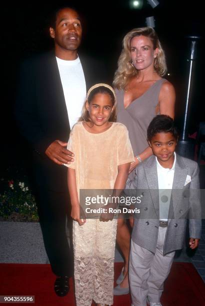 Simpson and Nicole Brown Simpson walk the red carpet with their children Sydney and Justin as they attend the 'Naked Gun 33 1/3: The Final Insult'...
