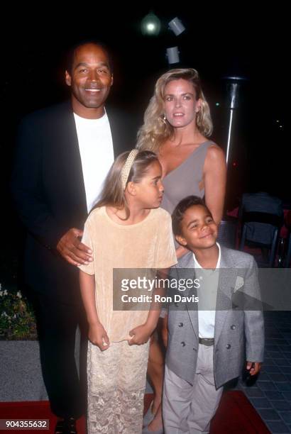 Simpson and Nicole Brown Simpson walk the red carpet with their children Sydney and Justin as they attend the 'Naked Gun 33 1/3: The Final Insult'...