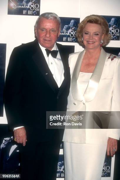 Legendary American singer Frank Sinatra poses with his wife Barbara for photographers shortly after a star studded event to honor his 80th birthday...