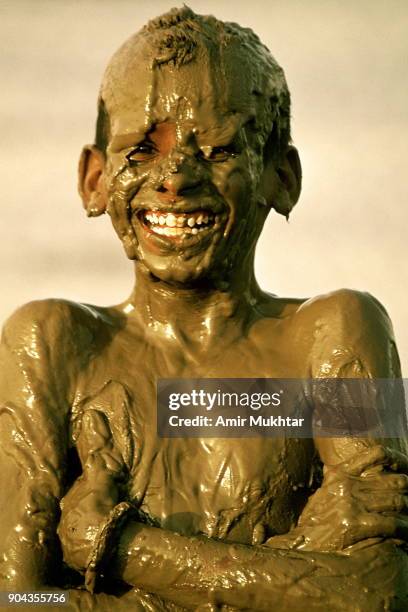 mud therapy (chocolate boy) - mudbath stock pictures, royalty-free photos & images