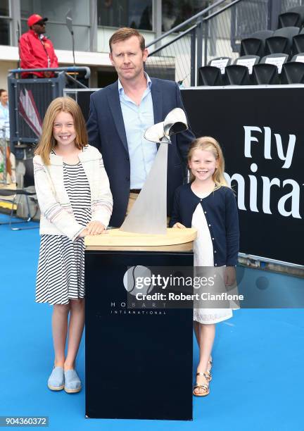 Pat Cunningham and his daughters Maggie and Sophie pose with the new trophy, which was made in honor of his late wife Angie Cunningham, during the...