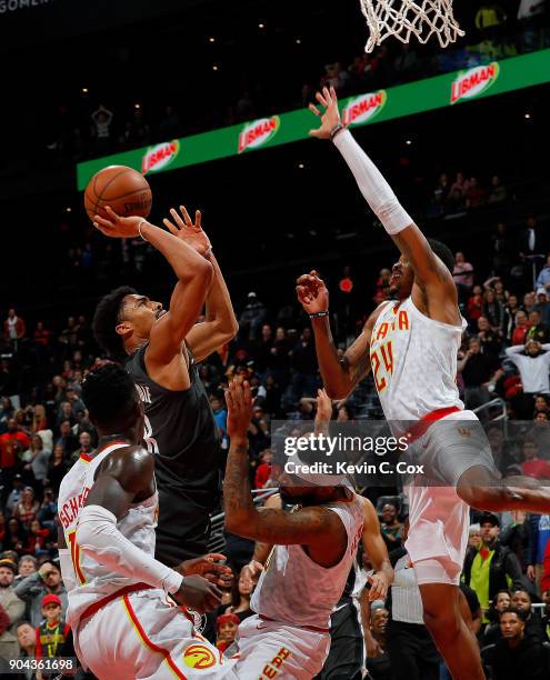 Spencer Dinwiddie of the Brooklyn Nets hits this go-ahead basket in the final seconds as he draws a foul from Malcolm Delaney of the Atlanta Hawks at...