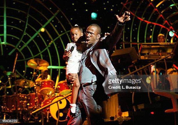 From left, American vocalist Bobbi Brown and his daughter, Bobbi Kristina Brown, onstage during a concert by his wife, Whitney Houston, New York, New...