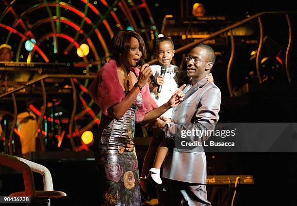 American vocalist Whitney Houston onstage, with her daughter, Bobbi Kristina Brown, and husband, fellow singer Bobbi Brown, during a concert, New...