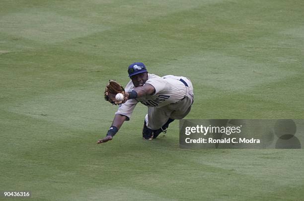 Tony Gwynn of the San Diego Padres fields a ball during a MLB game against the Florida Marlins at Landshark Stadium on August 30, 2009 in Miami,...