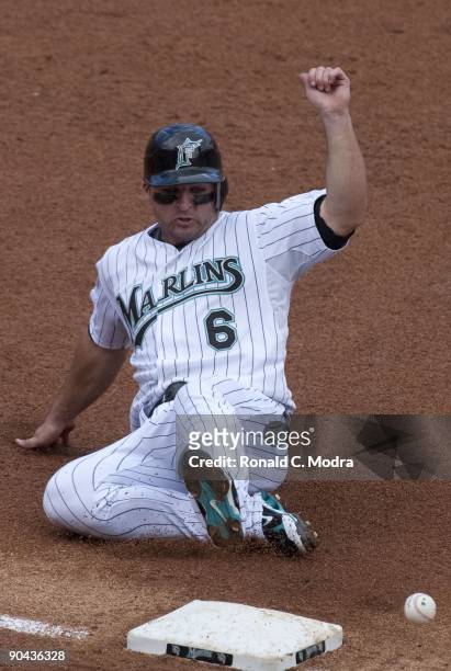 Dan Uggla of the Florida Marlins slides into third base during a MLB game against the San Diego Padres at Landshark Stadium on August 30, 2009 in...