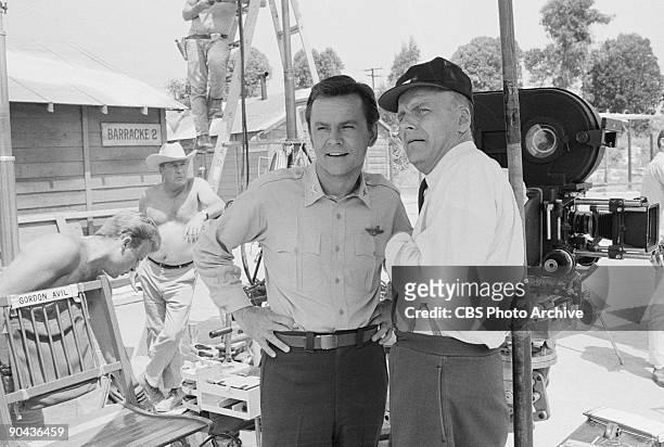 Bob Crane as Col. Robert E. Hogan, left, and Werner Klemperer as Col. Wilhelm Klink in between scenes of ?A Klink, A Bomb And A Short Fuse?, an...
