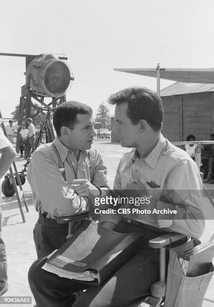Robert Clary as Cpl. Louis LeBeau and Bob Crane as Col. Robert E. Hogan in between scenes of ?A Klink, A Bomb And A Short Fuse?, an episode from CBS'...