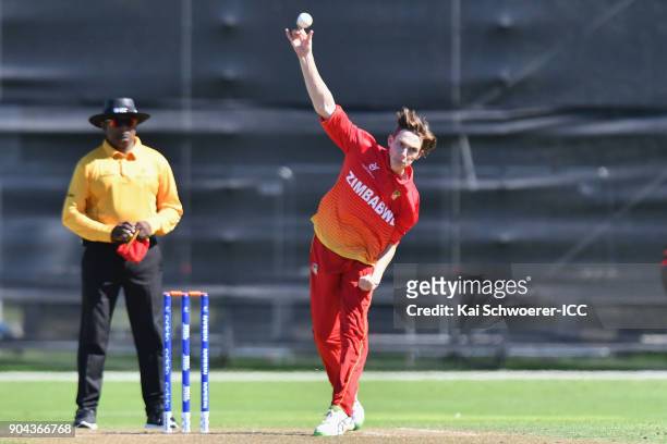 Liam Roche of Zimbabwe bowls during the ICC U19 Cricket World Cup match between Zimbabwe and Papua New Guinea at Lincoln Green on January 13, 2018 in...