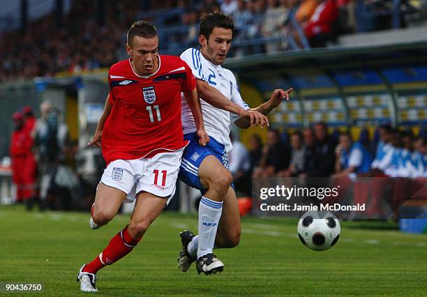 Tom Cleverley of England battles with Leonidas Argyropoulos of Greece during the UEFA U21 Championship match between Greece and England at the...