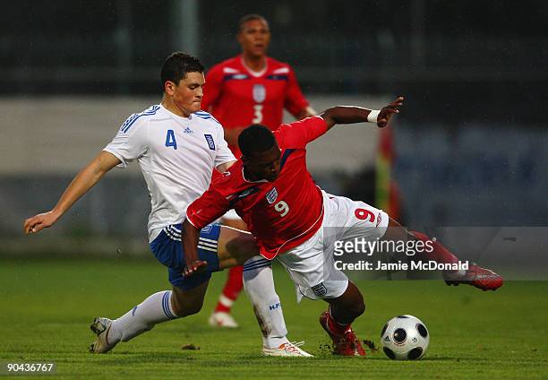 Daniel Sturridge of England battles with Kyriakos Papadopoulous of Greece during the UEFA U21 Championship match between Greece and England at the...