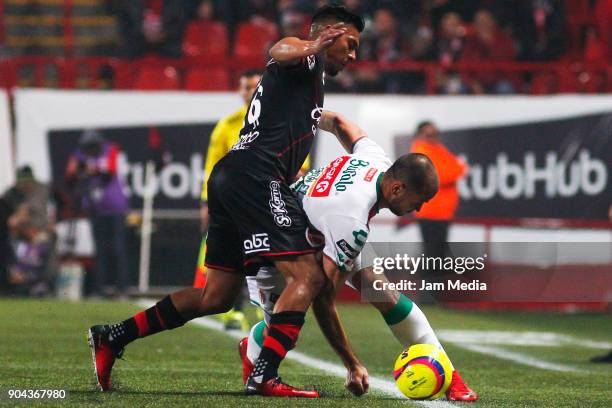 Michael Orozco of Tijuana and Carlos Gonzalez of Necaxa fight for the ball during the second round match between Tijuana and Necaxa as part of Torneo...