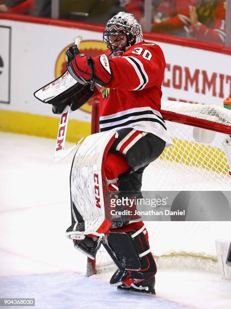 Jeff Glass of the Chicago Blackhawks celebrates his first home win against the Winnipeg Jets at the United Center on January 12, 2018 in Chicago,...