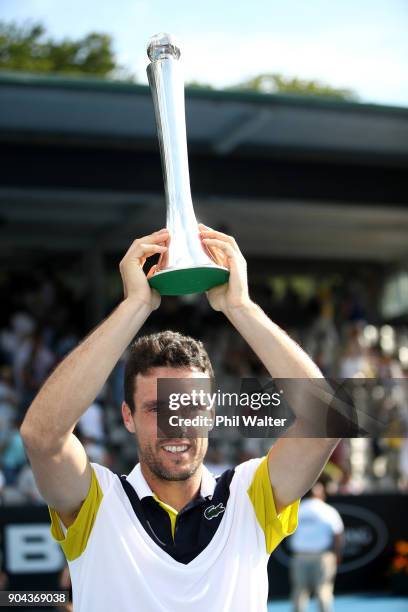 Roberto Bautista Agut of Spain poses with the trophy following his Mens Singles Final win over Juan Martin Del Potro of Argentina during day six of...