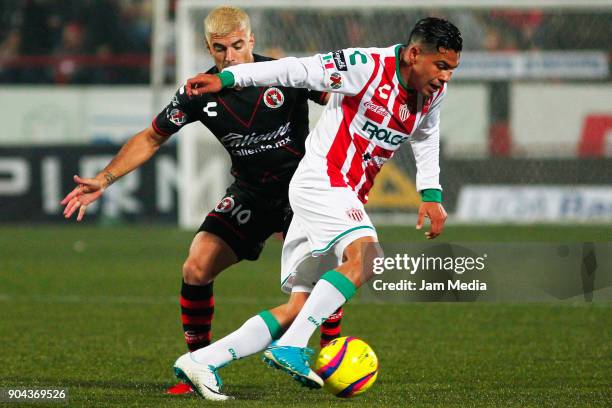 Ignacio Malcorra of Tijuana and Luis Perez of Necaxa fight for the ball during the second round match between Tijuana and Necaxa as part of Torneo...