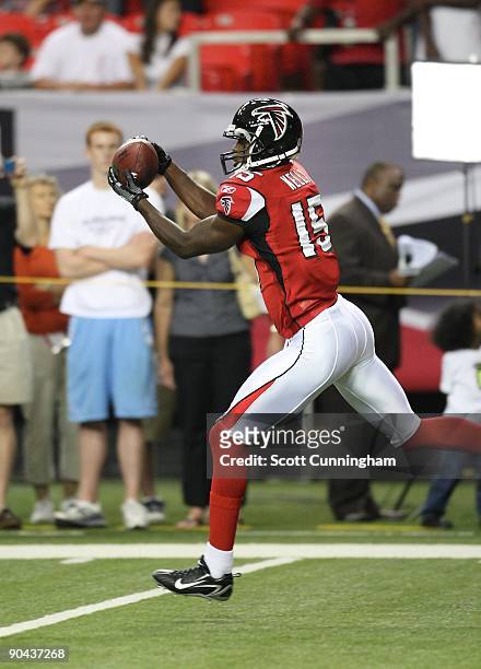 Aaron Kelly of the Atlanta Falcons makes a catch during warmups against the San Diego Chargers during a preseason game at the Georgia Dome on August...