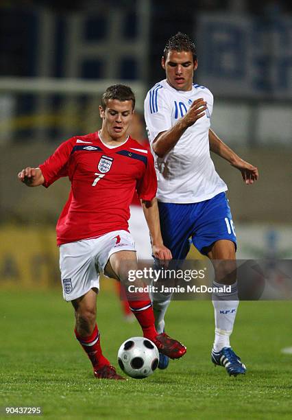 Jack Wilshere of England battles with Panagiotis Tachtsidis of Greece during the UEFA U21 Championship match between Greece and England at the...