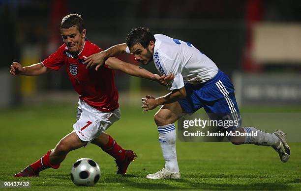 Jack Wilshere of England battles with Michail Boukouvalas of Greece during the UEFA U21 Championship match between Greece and England at the Asteras...