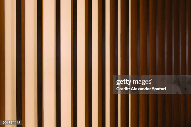 gold colored abstract striped architectural detail - golden pattern on walls fotografías e imágenes de stock