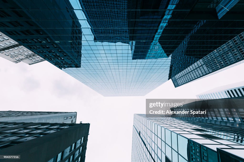 Directly below view of modern office buildings in Manhattan Fincancial District, New York, USA