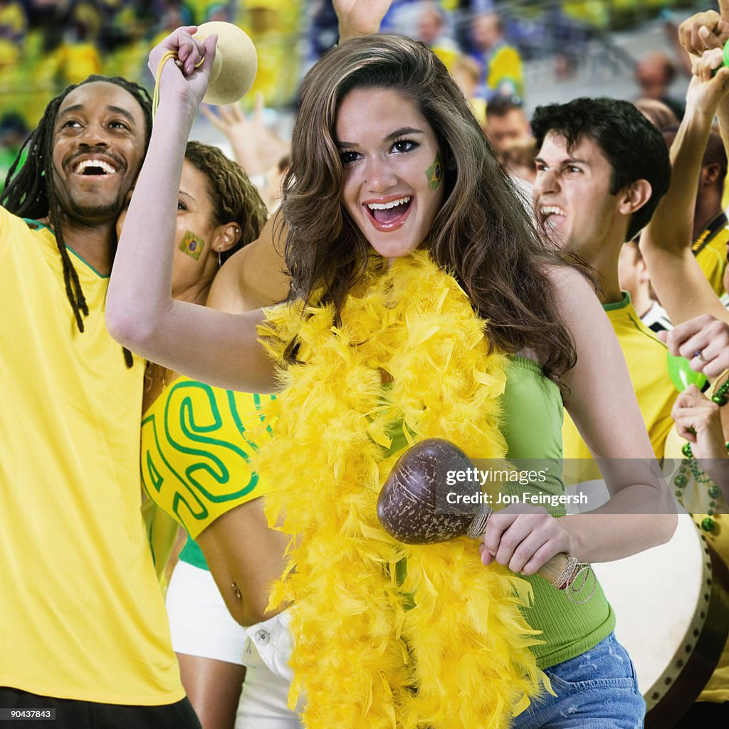 Brazilian football fans dancing and cheering
