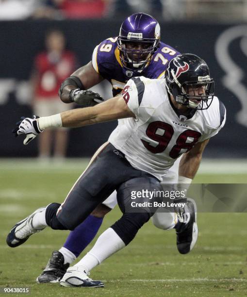 Defensive end Connor Barwin of the Houston Texans goes around guard Artis Hicks of the Minnesota Vikings at Reliant Stadium on August 31, 2009 in...