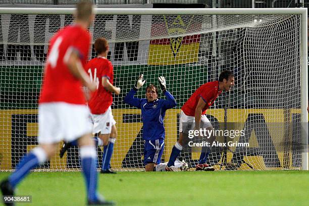 Goalkeeper Tobias Sippel of Germany reacts as Michael Rabusic of Czech Republic celebrates his team's first goal during the UEFA U21 Championship...