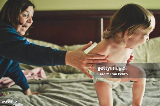 grandmother and granddaughter. - seize the day bed stock pictures, royalty-free photos & images