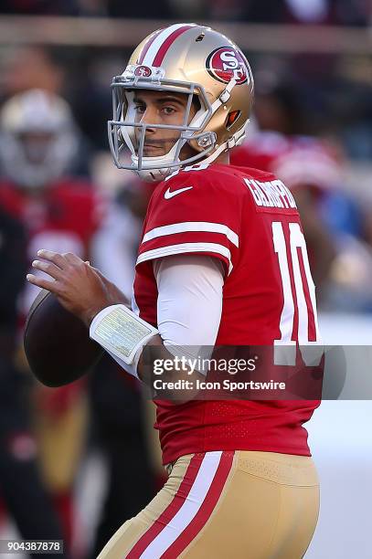 San Francisco 49ers quarterback Jimmy Garoppolo looks to pass during an NFL football game Sunday, Dec. 17, 2017 against the Tennessee Titans in Santa...