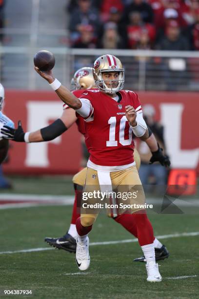 San Francisco 49ers quarterback Jimmy Garoppolo looks to pass during an NFL football game Sunday, Dec. 17, 2017 against the Tennessee Titans in Santa...