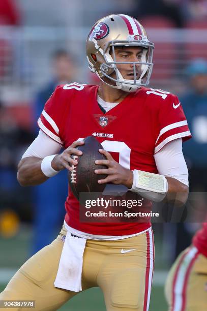 San Francisco 49ers quarterback Jimmy Garoppolo looks to pass during an NFL football game Sunday, Dec. 17, 2017 against the Tennessee Titans in Santa...