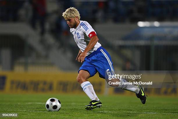 Vassilios Pliatsikas of Greece runs with the ball during the UEFA U21 Championship match between Greece and England at the Asteras Tripolis Stadium...