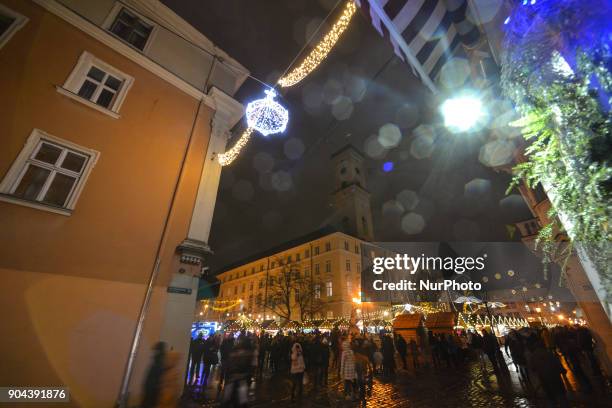 View of the busy Rynok Square with a bad wet and cold weather. On Friday, January 12 in Lviv, Lviv Oblast, Ukraine.